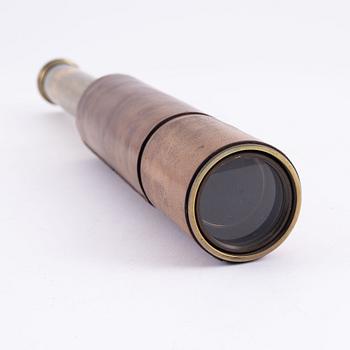 A brass spotting scope from I. H. Steward, London, circa 1900.