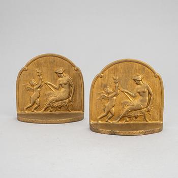 Simon Moselsio, a pair of bronze bookends, 20th Century.