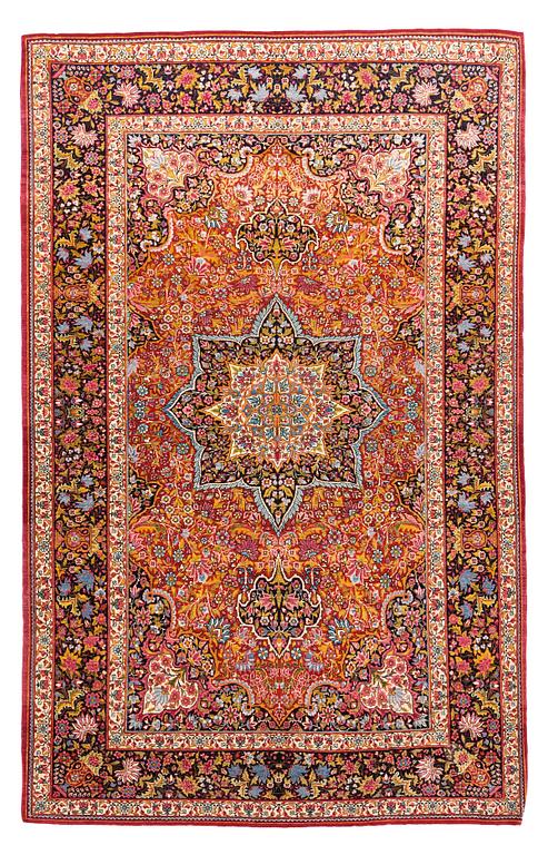 A rug, semi-antique Mashad, ca 224 x 141,5 cm.