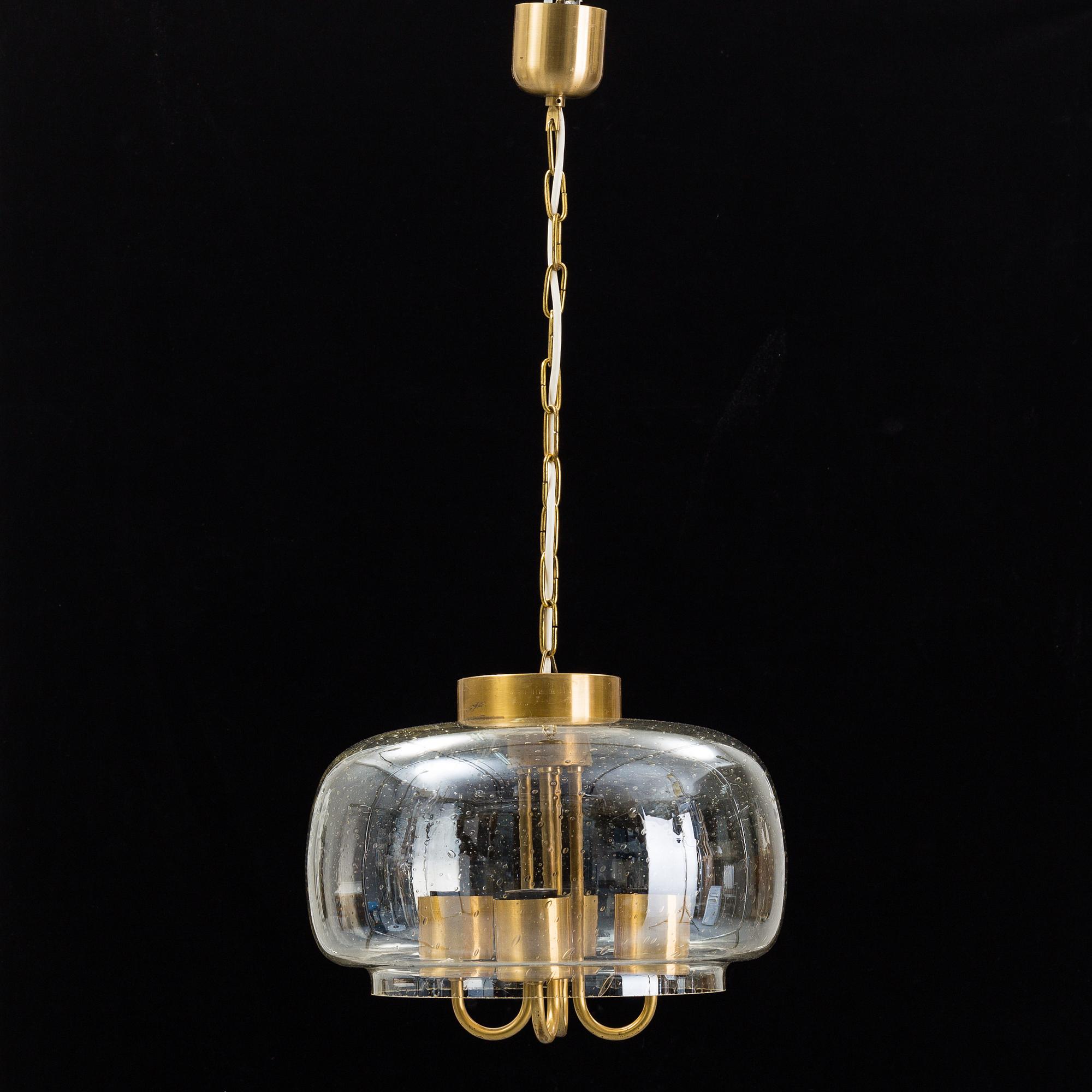 A 1960/70s glass and brass ceiling lamp.