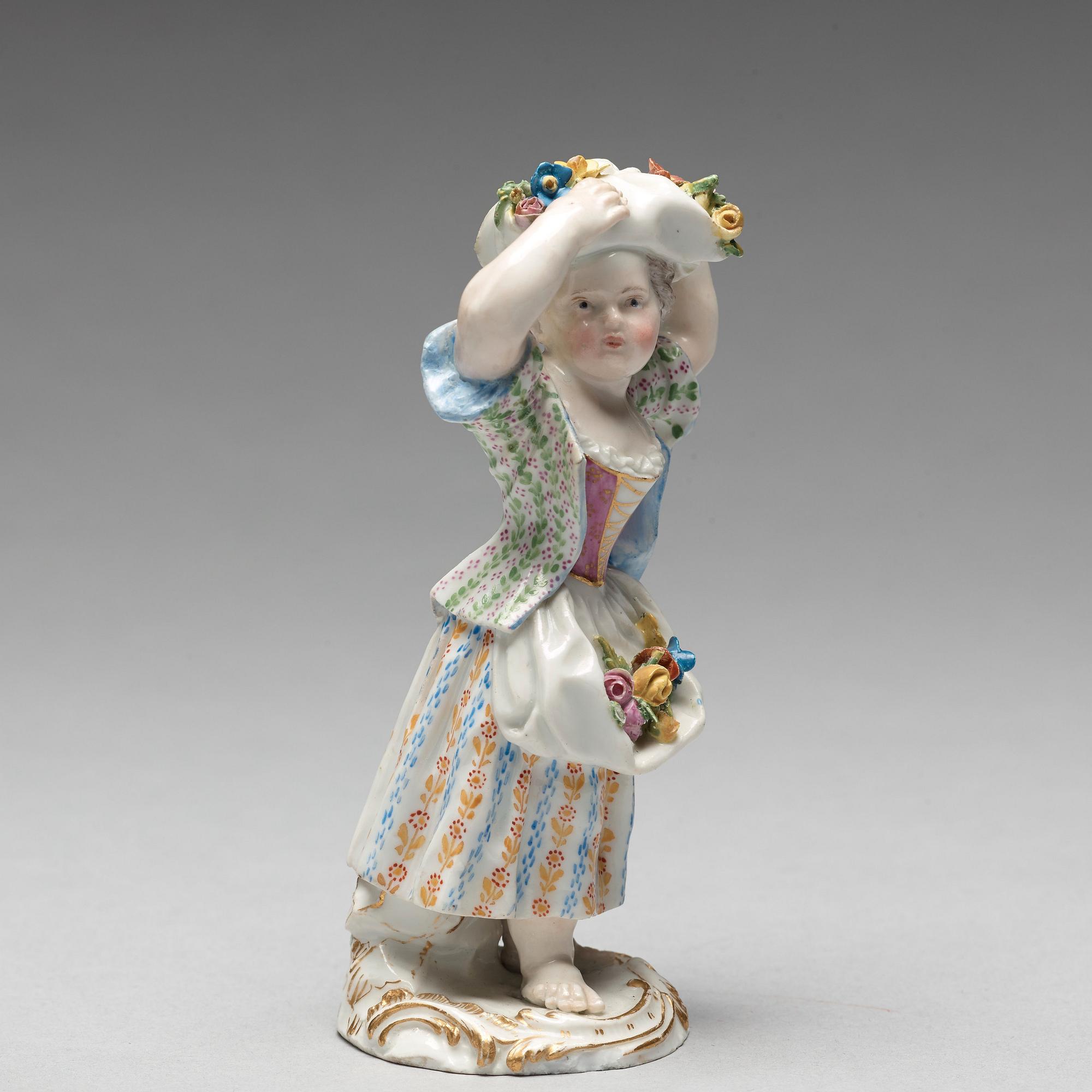 A Meissen figure of a girl with flowers, 1890's.