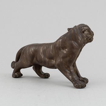 A Japanese bronze okimono in the shape of a tiger, Meiji period (1868-1912), late 19th century. Signed 'Mitani'.