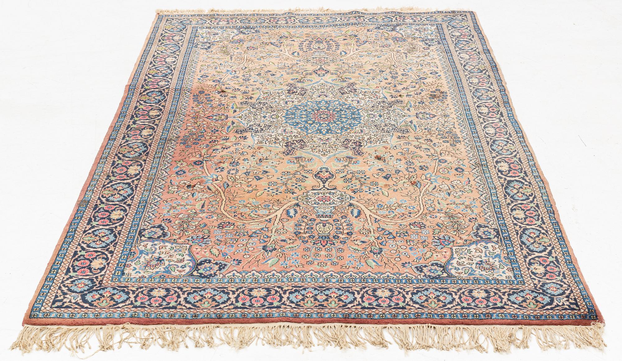 An oriental rug, circa 245 x 136 cm.