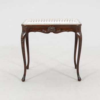 Rococo-style tea table signed and dated Rörstrand 1918 porcelain.