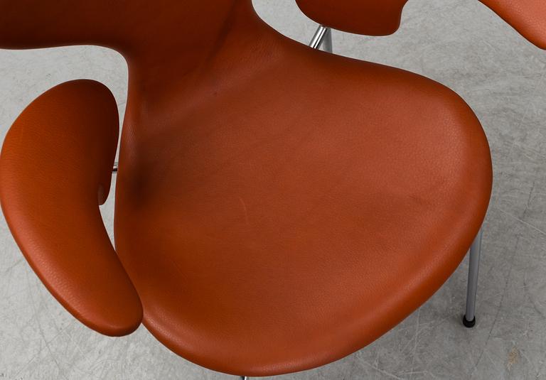 ARNE JACOBSEN, a 'Lily' leather covered armchair from Fritz Hansen, Denmark.