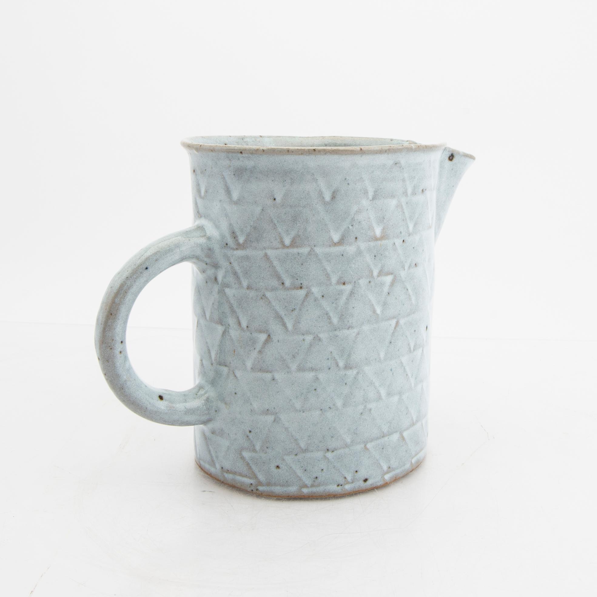 Signe Persson-Melin, a glazed ceramic pitcher, signed by hand.