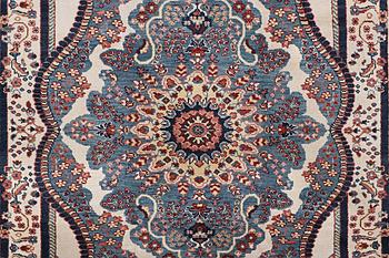 An oriental carpet with Mamluk design, c. 300 x 242 cm.