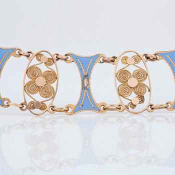 GARNITYR bestående av collier samt två armband med ljusblå emalj samt filigranarbete. Empire.