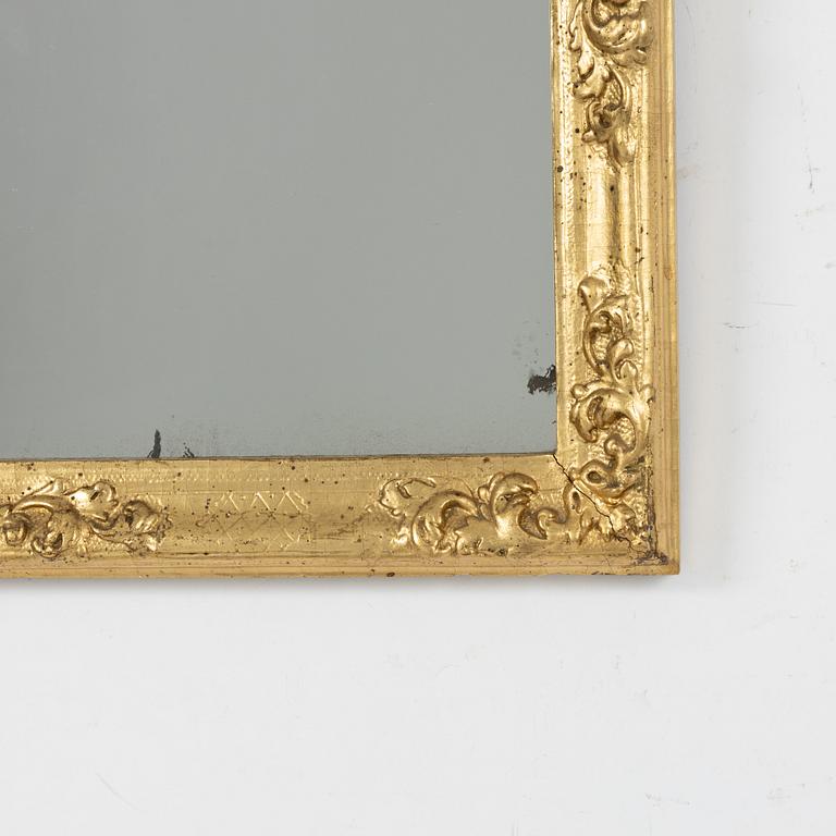 A North European late baroque giltwood mirror, first part of the 18th century.