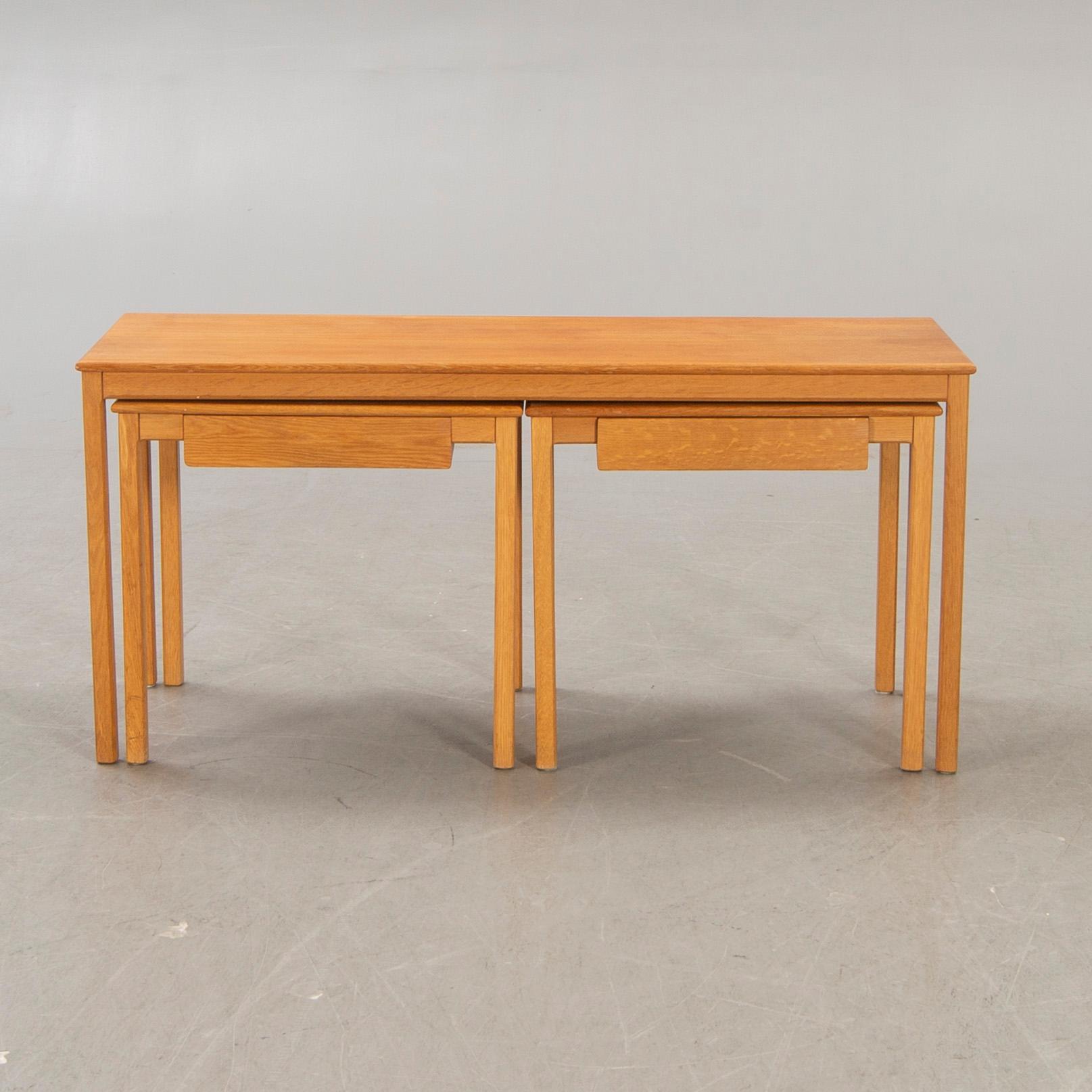 A 1960s oak nesting table.