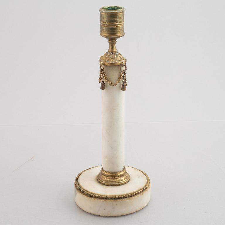 A late Gustavian gilt brass and marble candlestick, late 18th century.