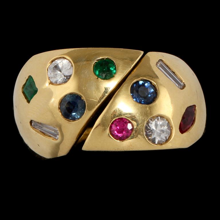 RING, 18k guld med fasettslipade rubiner, blå safirer och smaragder samt baguett och briljantslipade diamanter. Vikt 8 g.