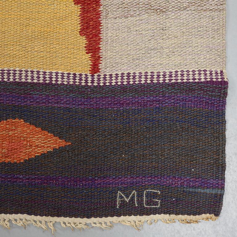 A CARPET, flat weave, ca 449 x 242,5 cm, signed MG, dated 1969.