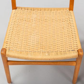 Hans J Wegner, a set of six beech and teak model CH-23 chairs, Denmark.