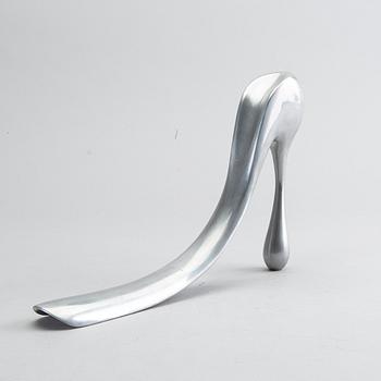 A metal shoe horn by Manolo Blahnik.