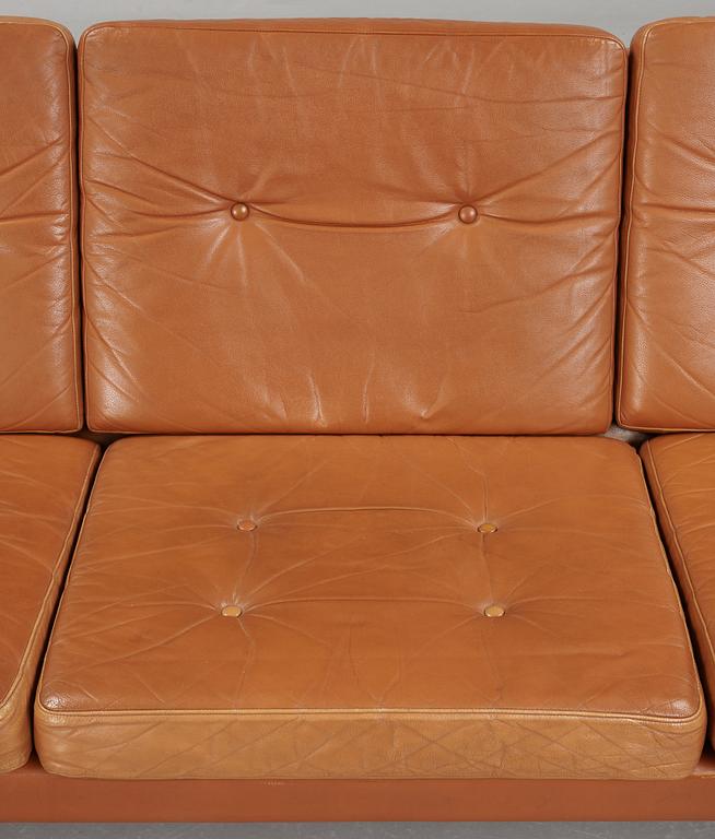 A Poul Nørreklit chromed steel and brown leather three seated sofa, Selectform, Denmark 1960's.