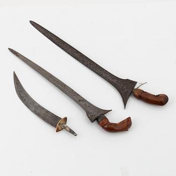 Two Indonesian keris an a blade for a dagger.