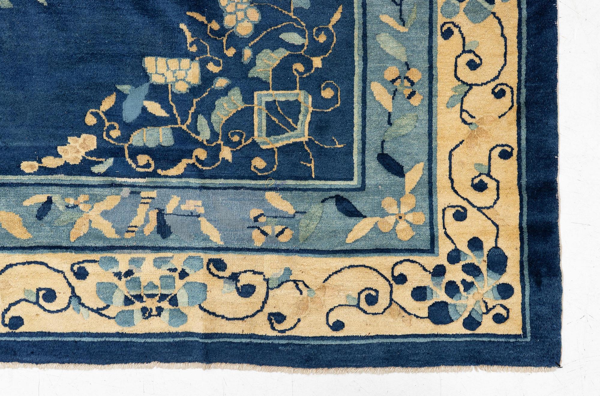 An antique Peking (Beijing) carpet, North China, c. 340 x 275 cm.