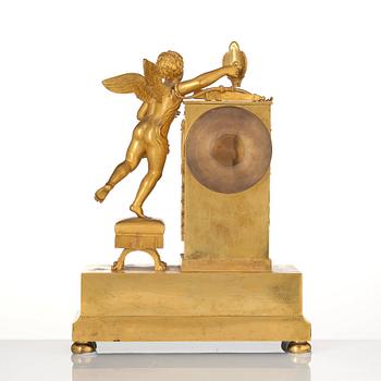 An Empire ormolu figural mantel clock, early 19th century.