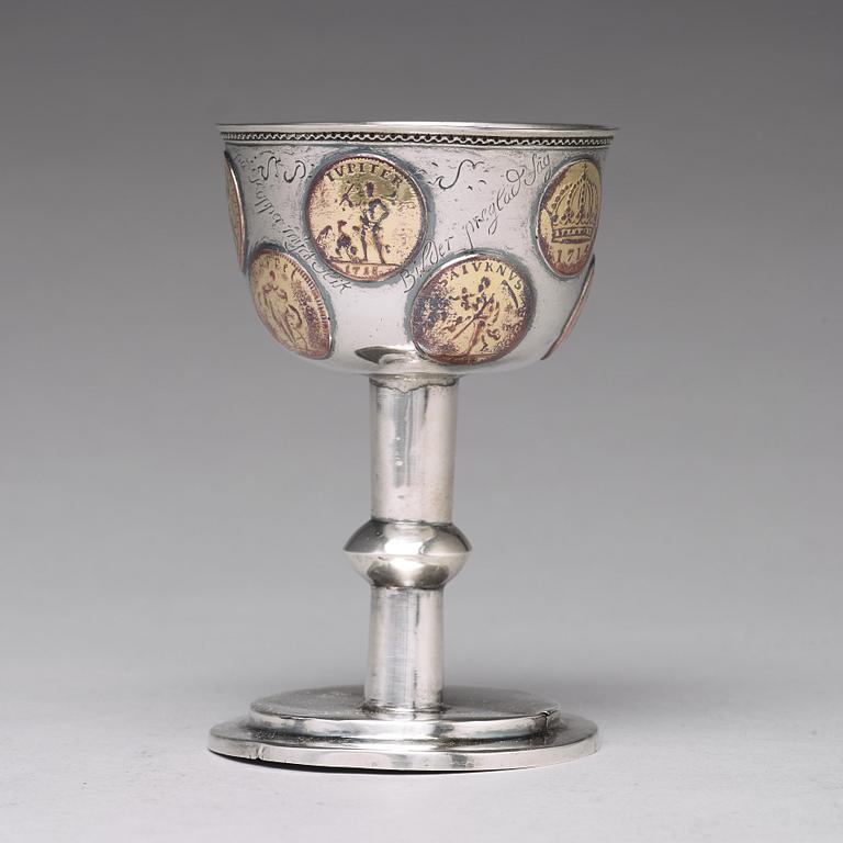 A Swedish 18th century parcel-gilt silver tumbler / cup, with copper coins, unmarked.