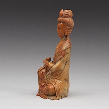 A stone sculpture of Guanyin, Qing dynasty (1644-1912).