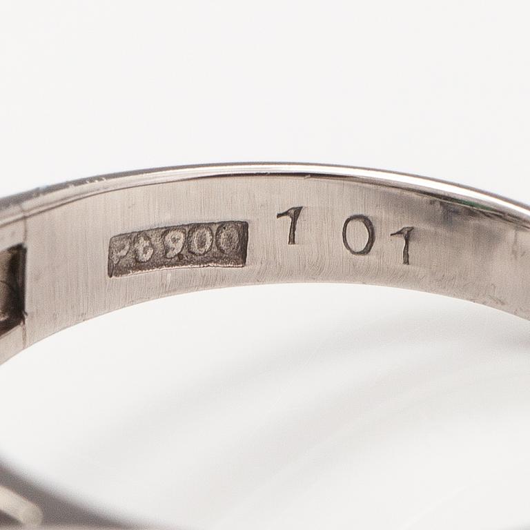 A platinum ring with a ca. 1.15 ct emerald and ca. 1.00 cts of diamonds in total.