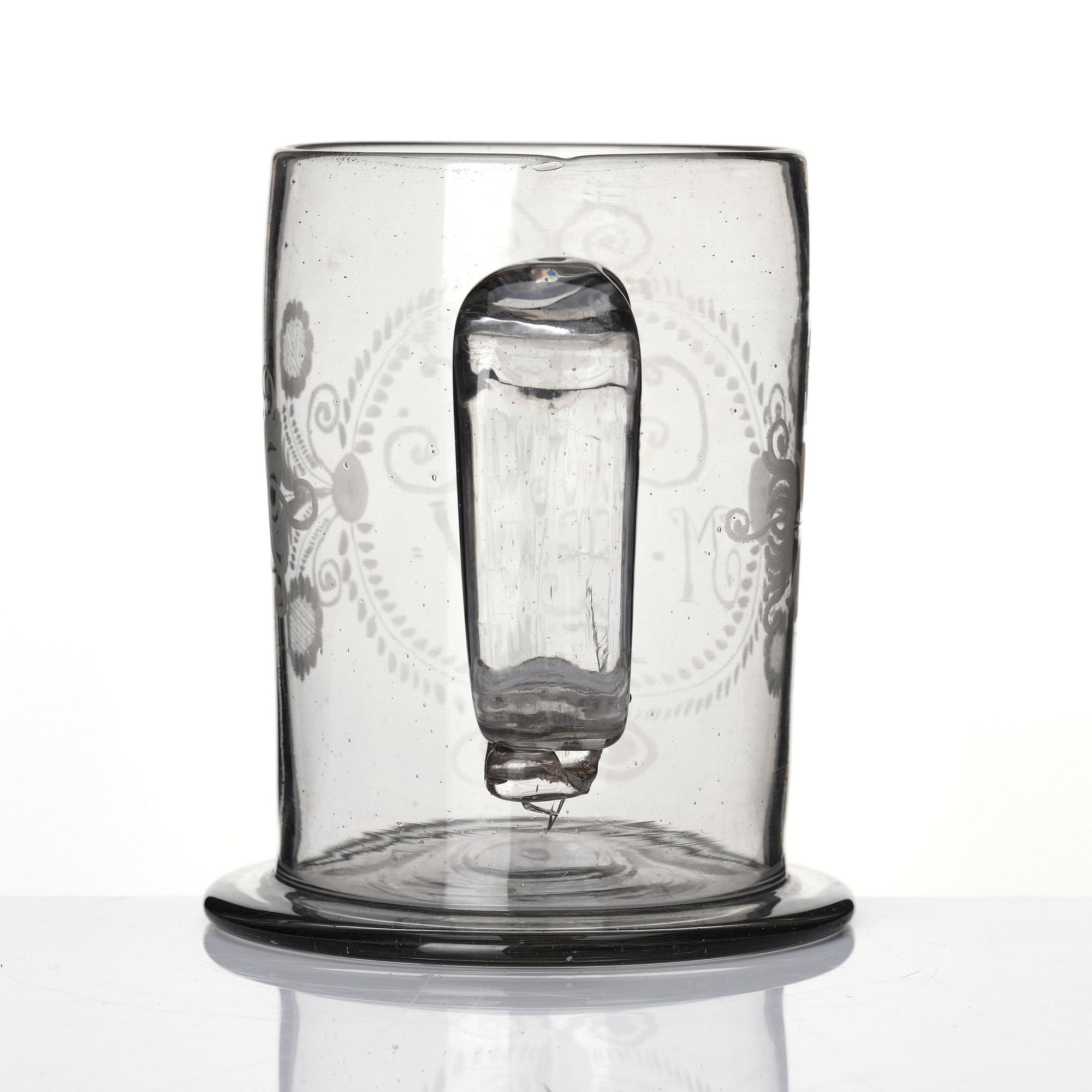 A large tankard, 18th Century with eched monogram for 'G.R.G' and 'M.E.W.' 1781.