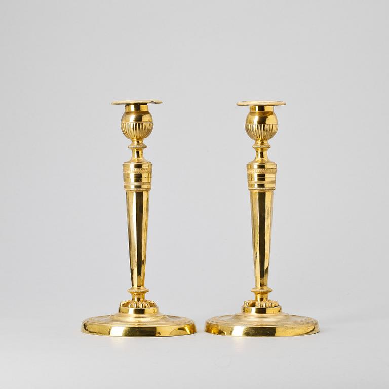 A pair of French Empire early 19th Century candlesticks.