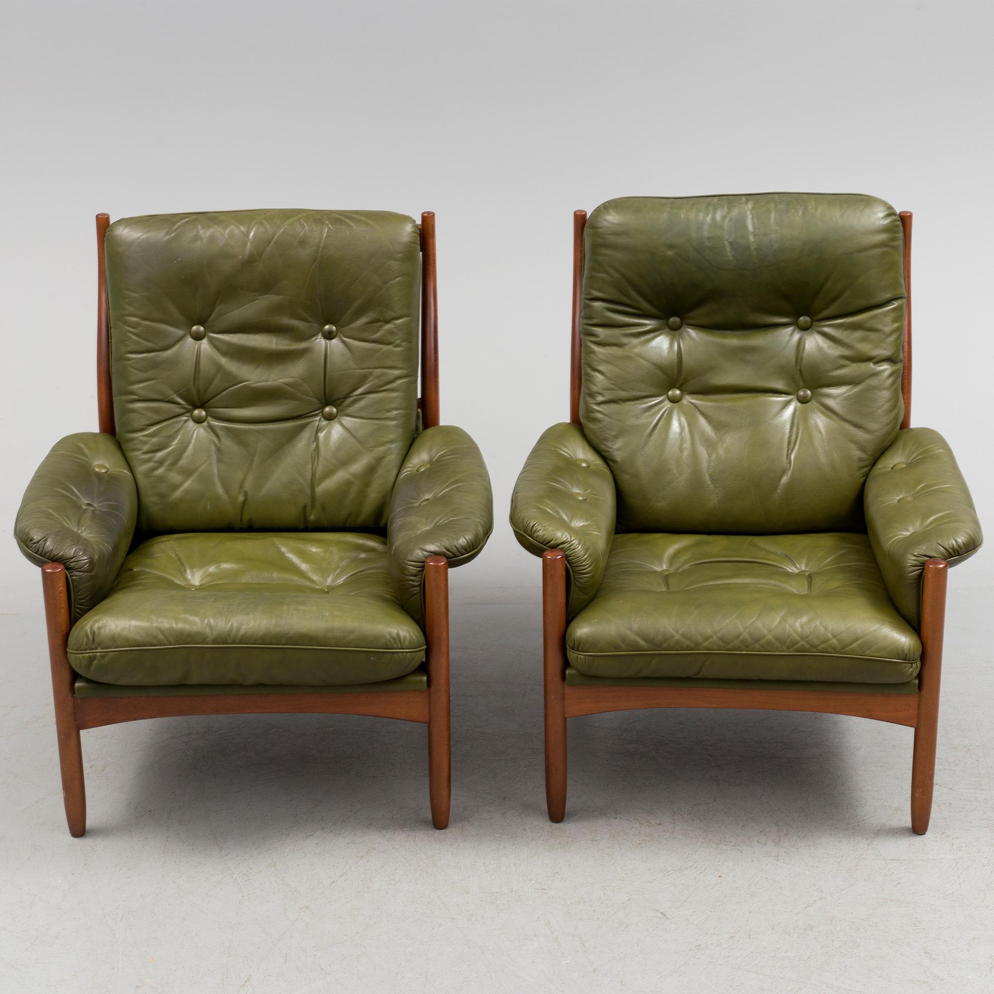 A pair of stained beech and leather easy chairs from Göte Möbler, Nässjö, second half of the 20th century.