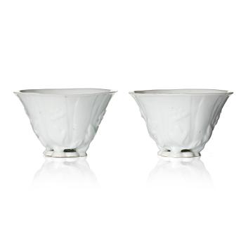 997. A pair of blanc de chine libation cups, Qing dynasty, 19th century.
