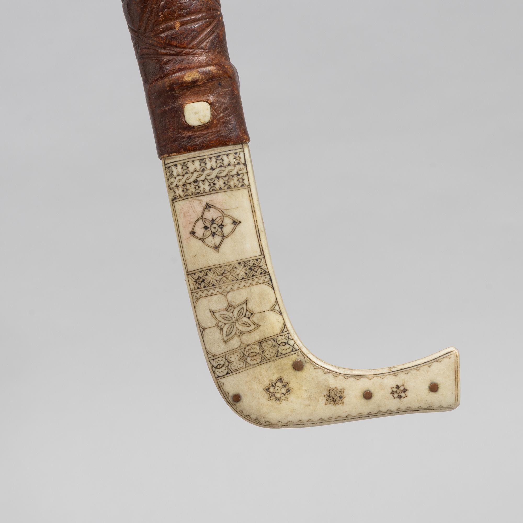 Per Erik Svonni, a reindeer horn knife, signed and dated 1928.