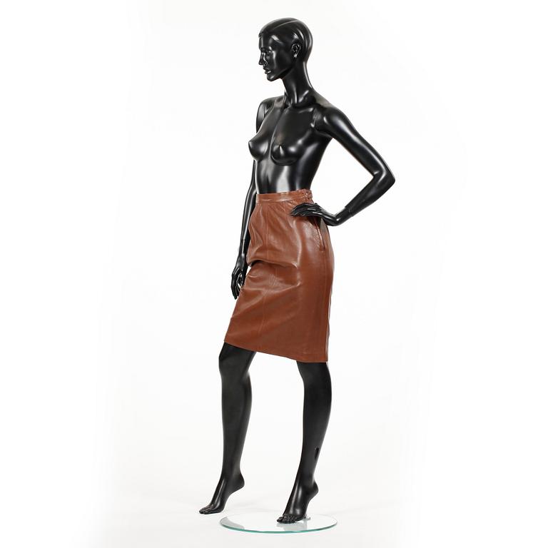 YVES SAINT LAURENT, a brown leather skirt.