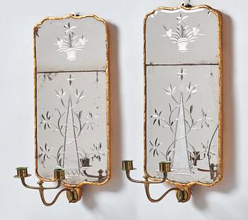 A pair of Rococo two-light girandole mirrors, by N. Sundström.