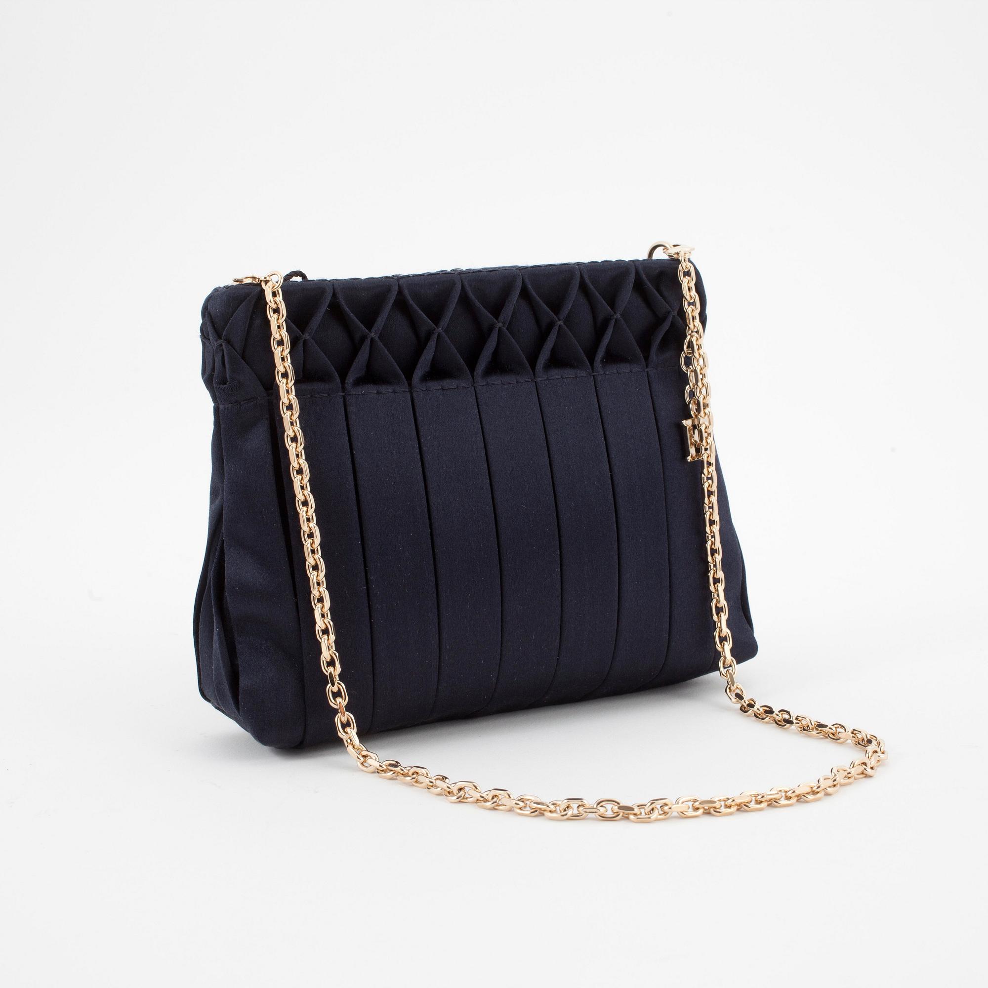 ESCADA, a blue silk evening bag.