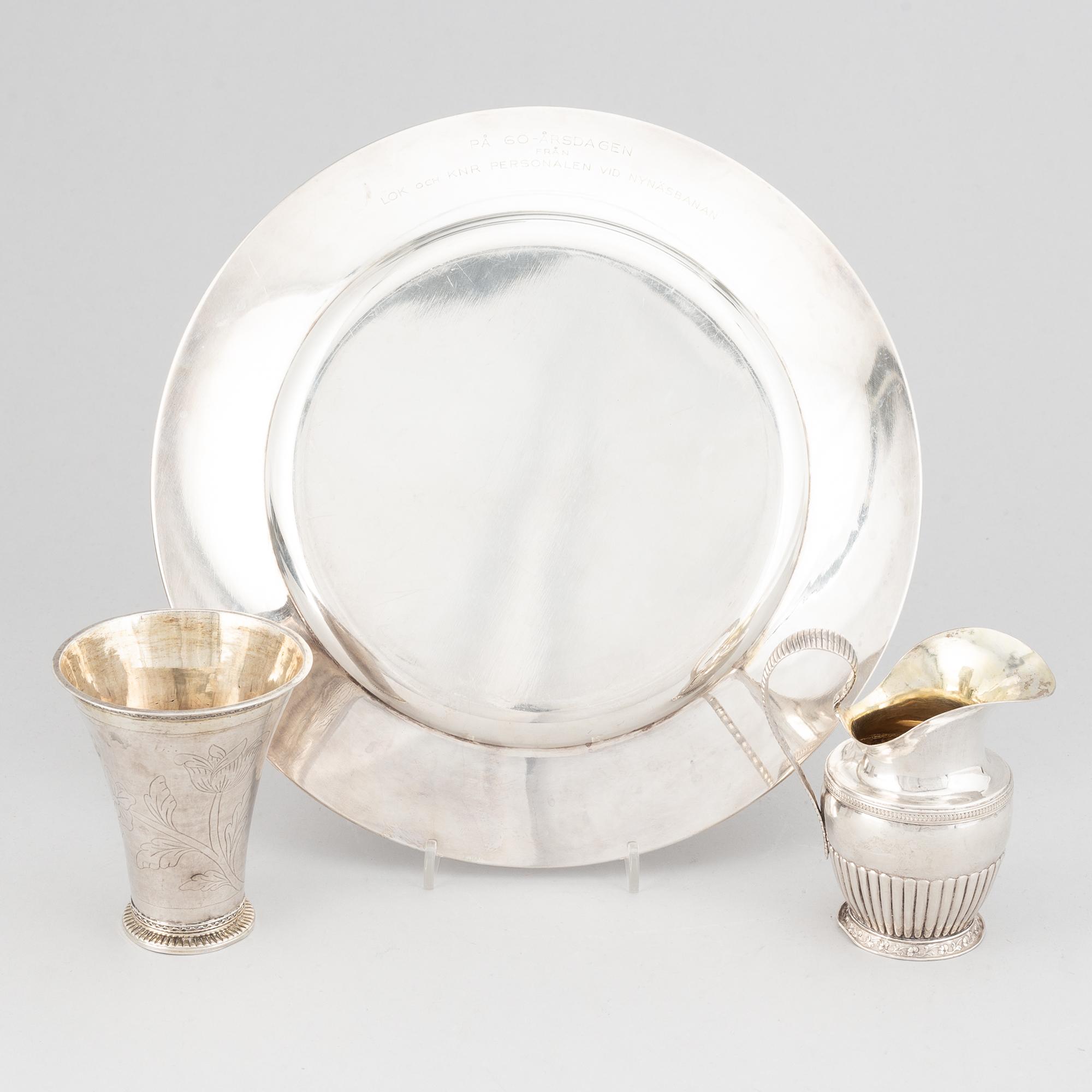 A silver creamer, beaker, and platter, Sweden, 18-19th century.