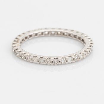 Brilliant-cut diamond eternity ring.