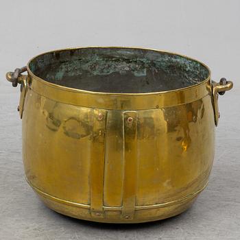 A large 19th century brass cauldron.