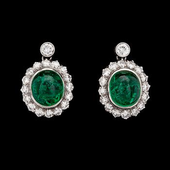 949. A pair of cabochon cut emerald and diamond earrings, 1950's.