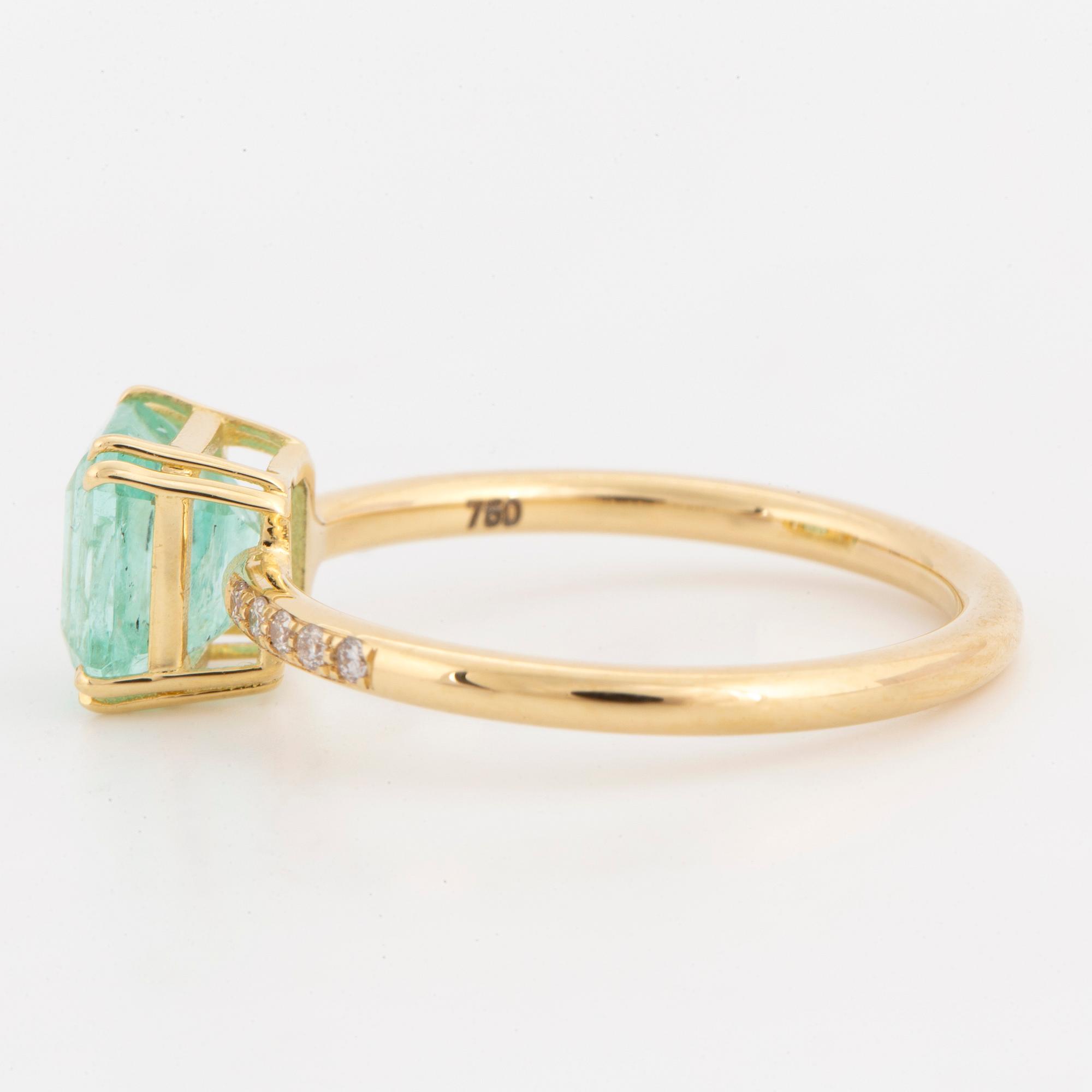 Emerald-cut  pale emerald and brilliant-cut diamond ring.
