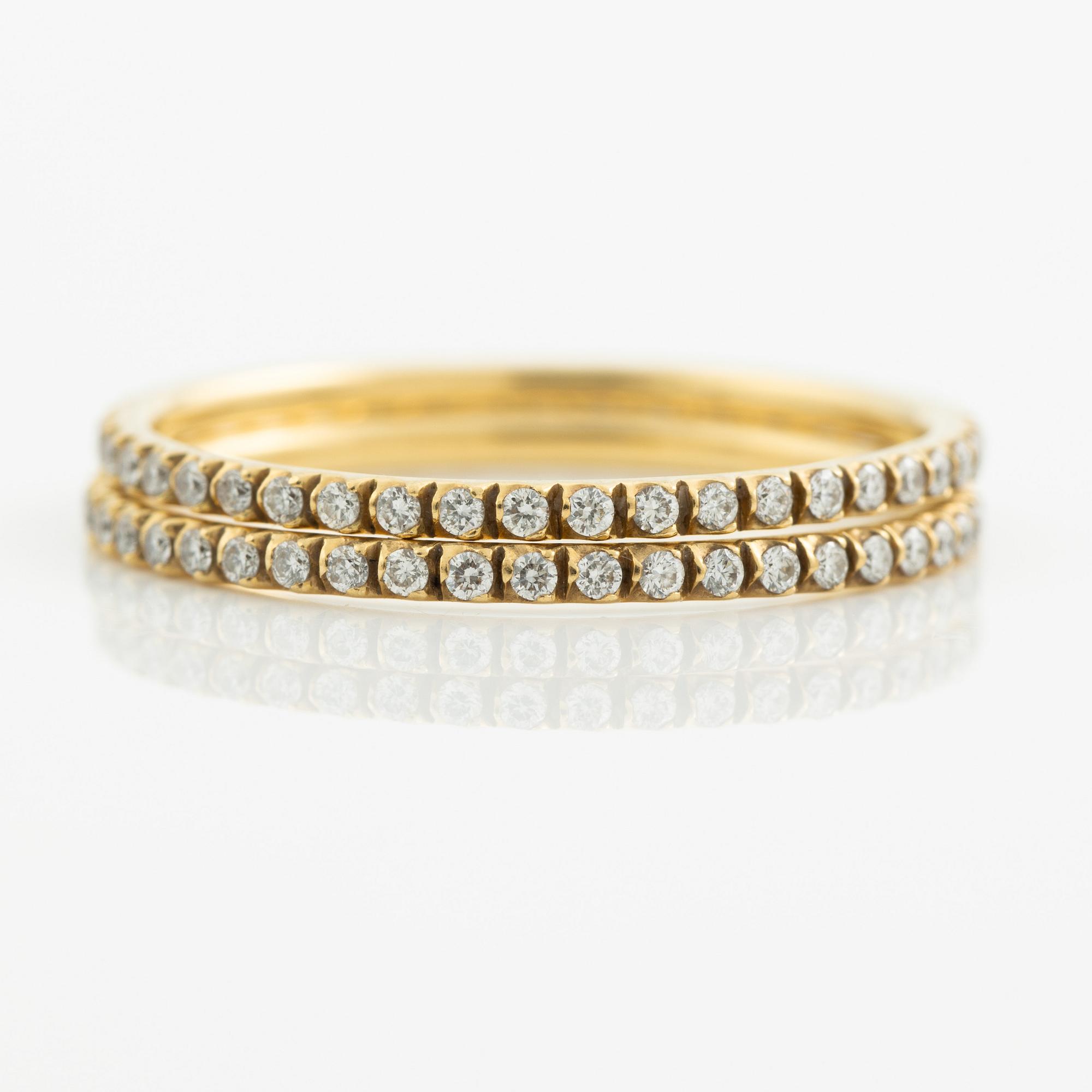 Ringar, Georg Jensen. ett par, "Signature", 18K guld med briljantslipade diamanter.
