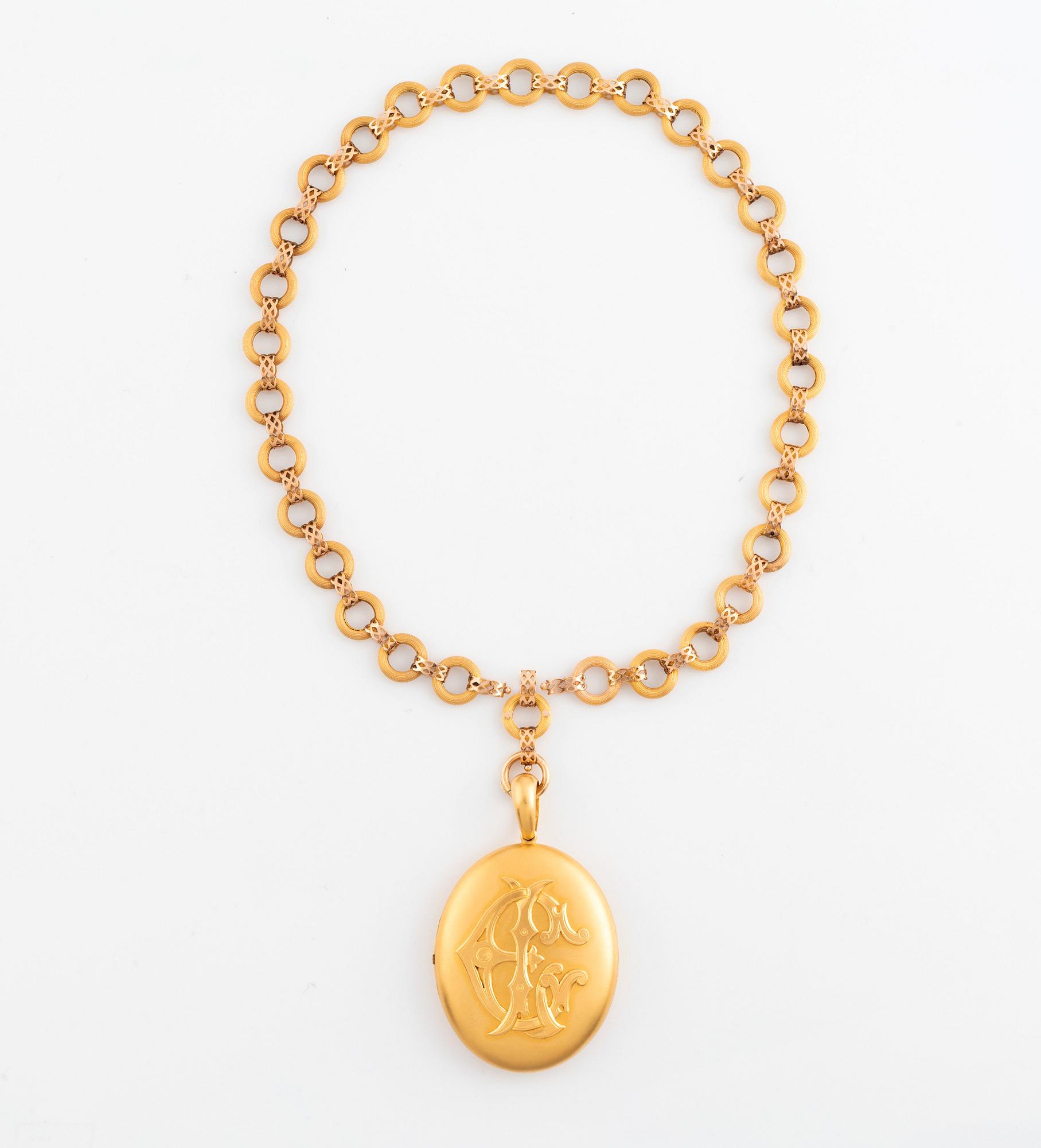 A gold locket with chain.