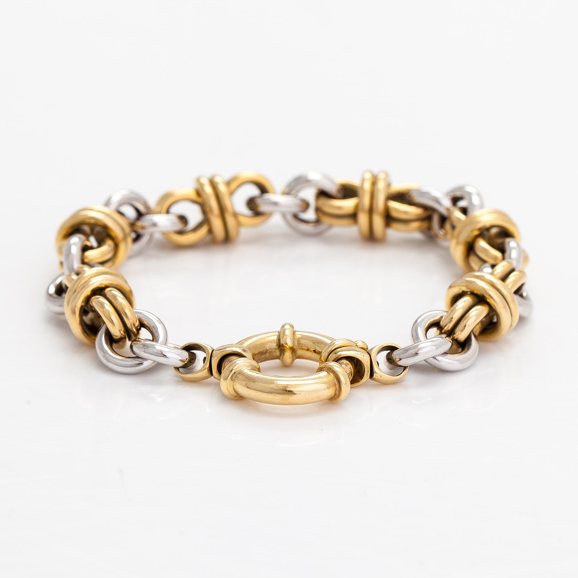 Armband, 18K vit- och gultguld. Oy Kultaiset Päivät - Gyllene Dagar Ab, Helsingfors 1999.