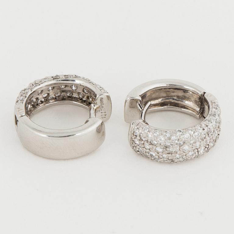 Platinum and brilliant-cut diamond earrings.