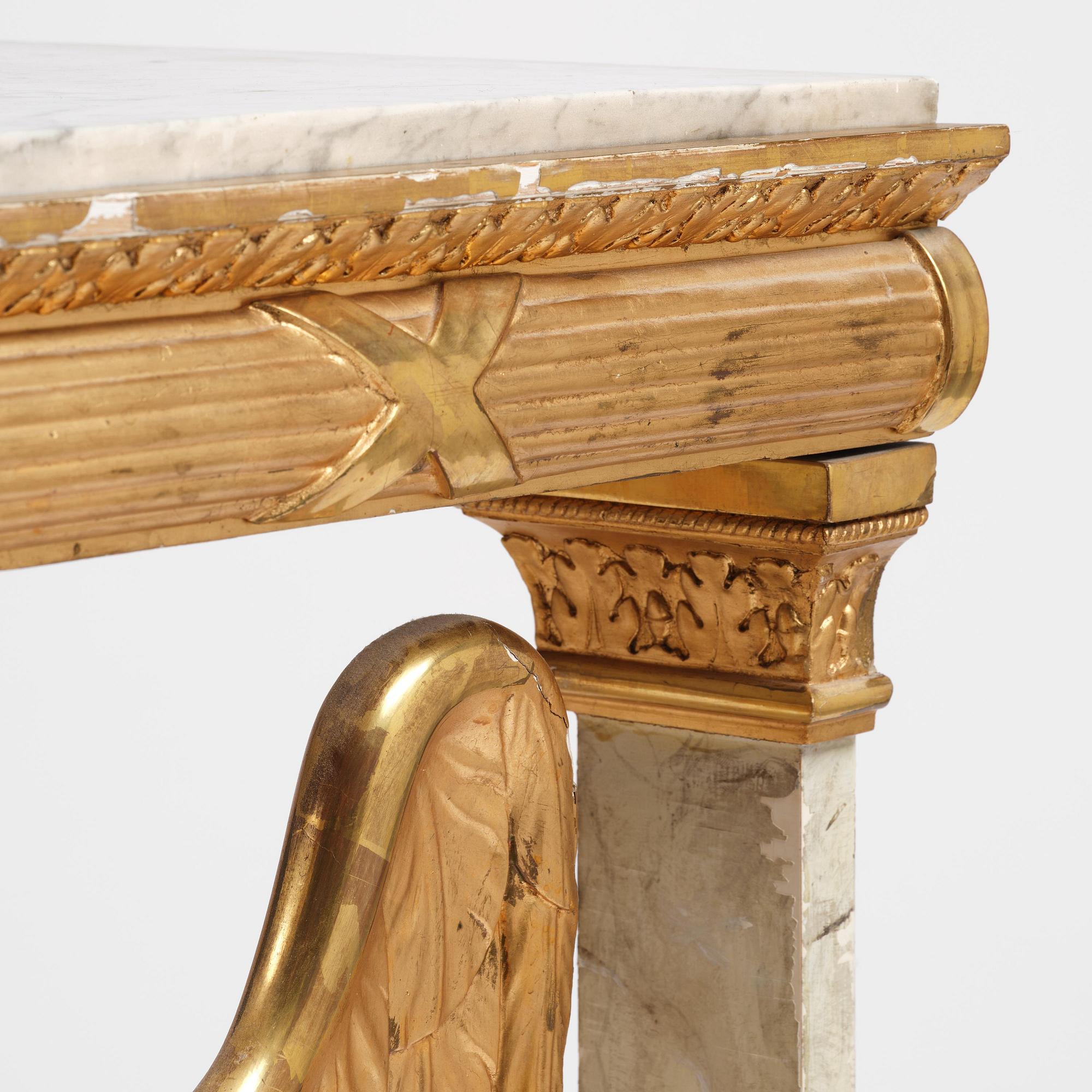 A Swedish Empire gilt wood and white marbel console table.