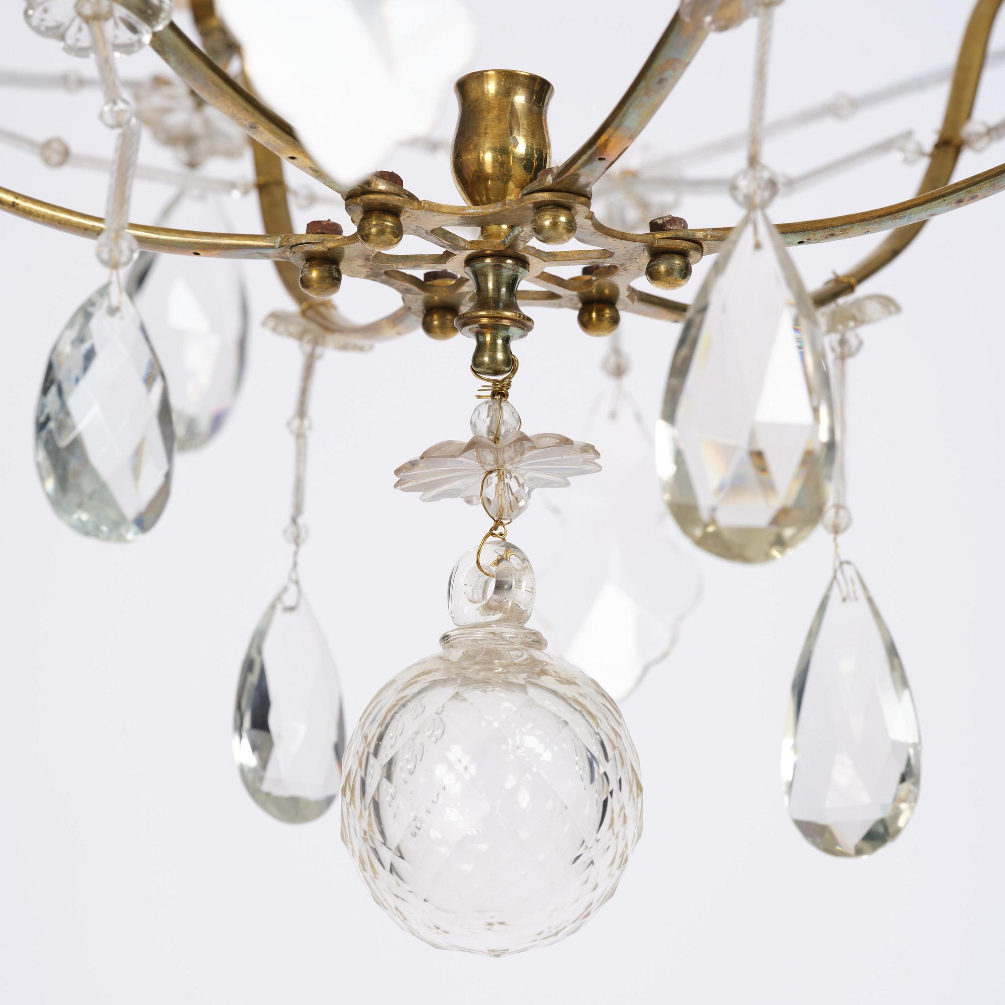 A seven-light gilt brass and cut glass rococo chandelier, mid 18th century.