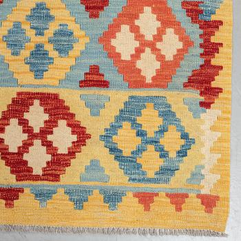 A carpet, kilim, ca 244 x 188 cm.