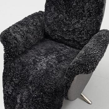 An easy chair with electrical adjustment.