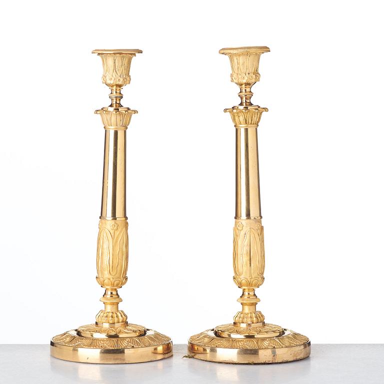 A pair of French Empire candlesticks, early 19th century.