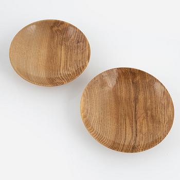 Magnus Ek, a set of eight ash wood plates for Oaxen Krog, 2021.