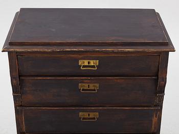 A chest of drawers, circa 1900.